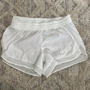 White Athleta mesh racer run shorts